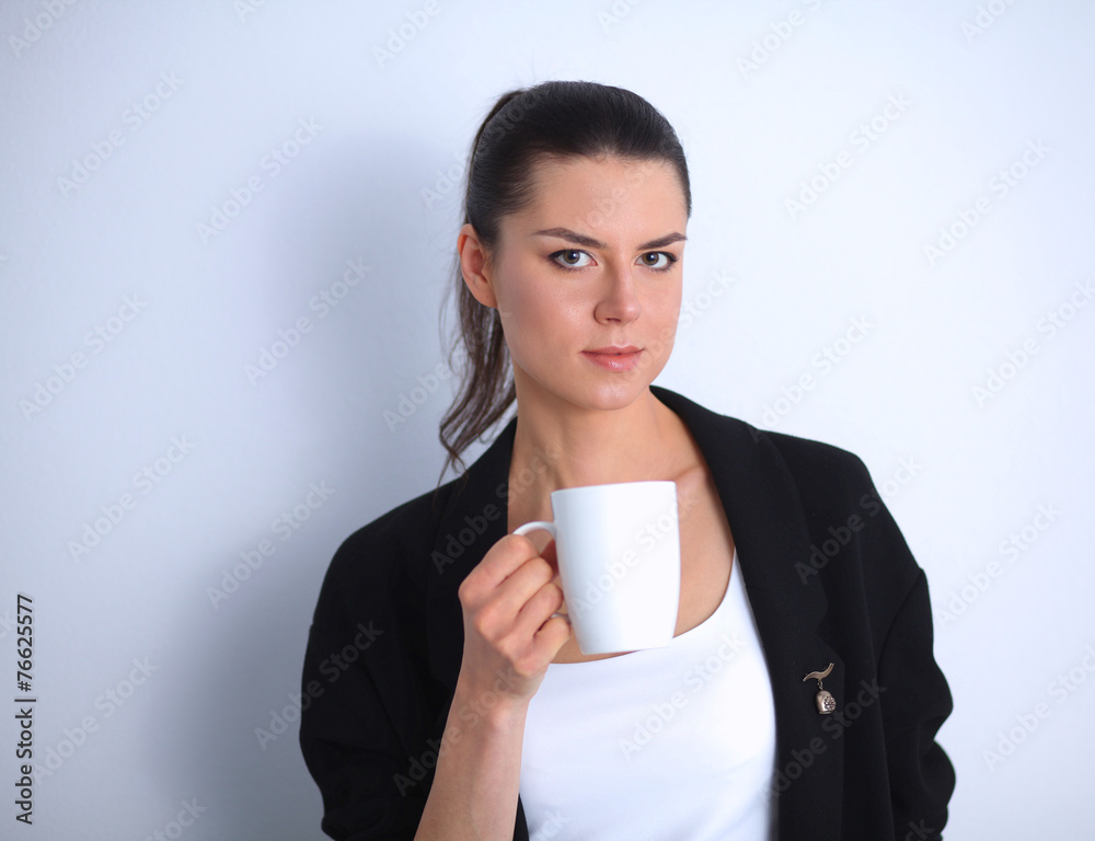 Young woman holding a mug, isolated on white background Young woman holding a mug, isolated on white background