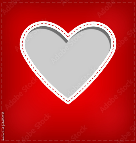Heart cutout in red card on grey background