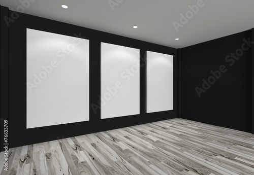 white canvas on black wall in the gallery