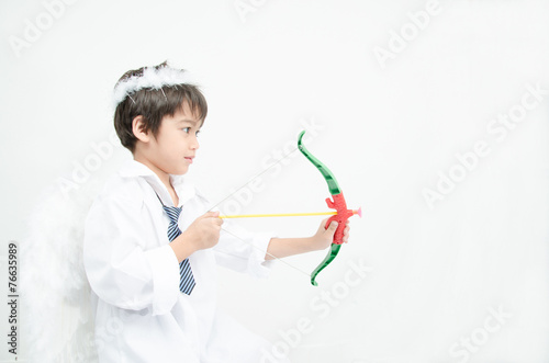 Little boy portrait pretend as cupid with wing