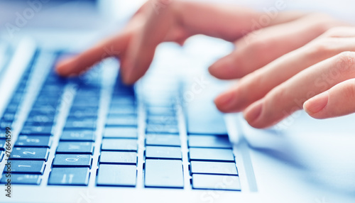 Close-up of typing female hands on keyboard