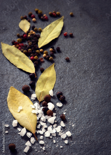 Assorted spices on a stone background
