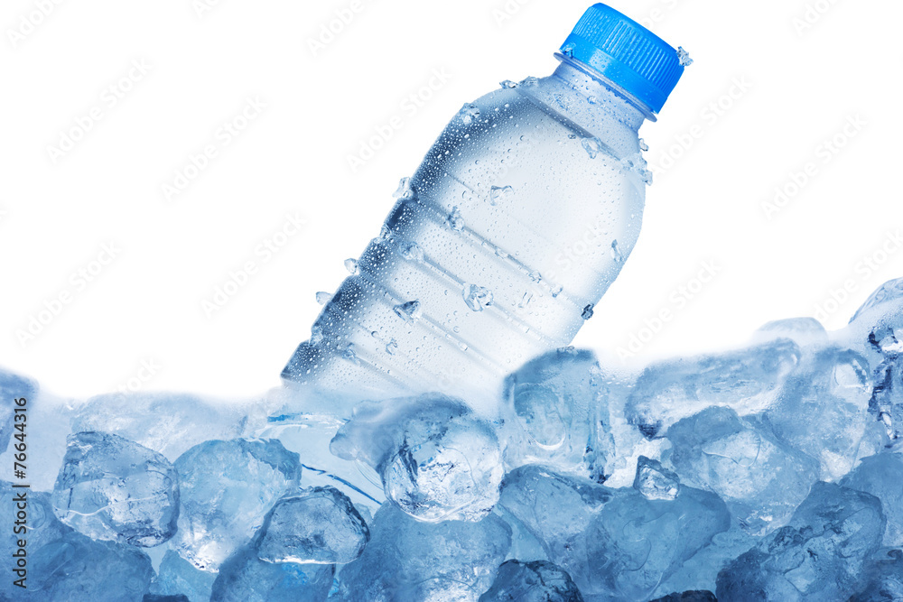 Cold Water Bottle on Ice Cubes Stock Photo
