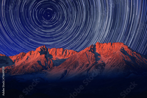 Print op canvas Night Exposure Star Trails of the Sky in Bishop California