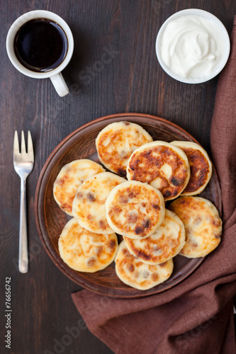 Delicious homemade cheese pancakes with coffee