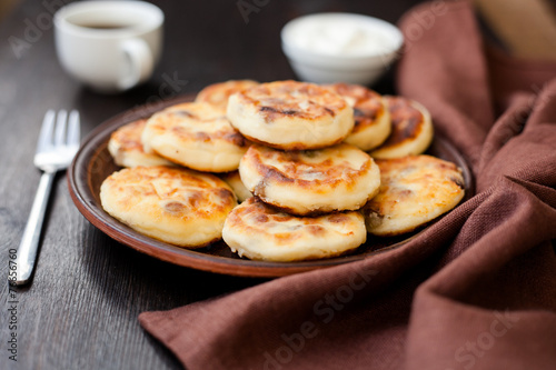 Delicious homemade cheese pancakes with coffee © Titarenko