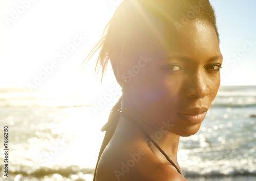 Beautiful black woman posing at the beach