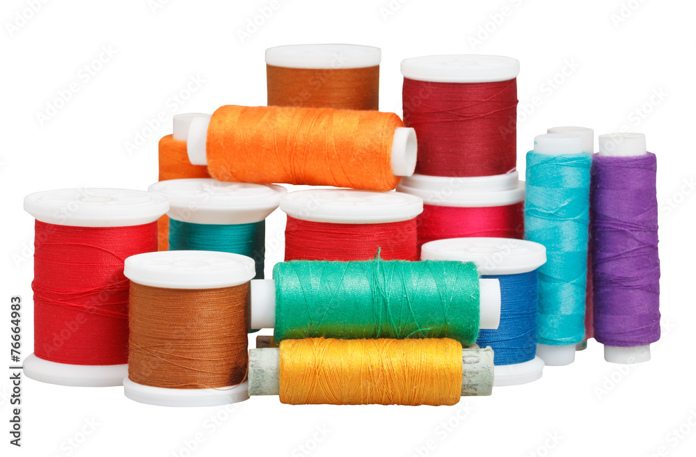 various thread spools isolated on white various thread spools isolated on white