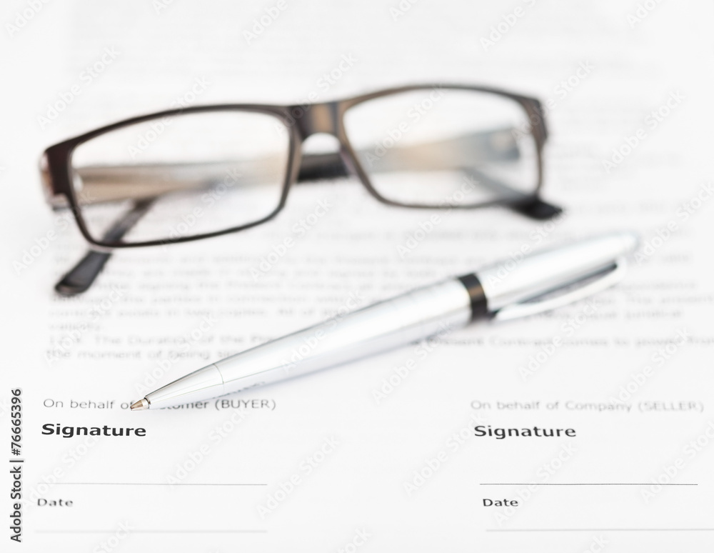 silver pen and eyeglasses on signature page silver pen and eyeglasses on signature page
