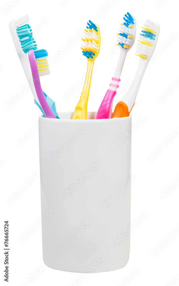five toothbrushes in ceramic glass five toothbrushes in ceramic glass