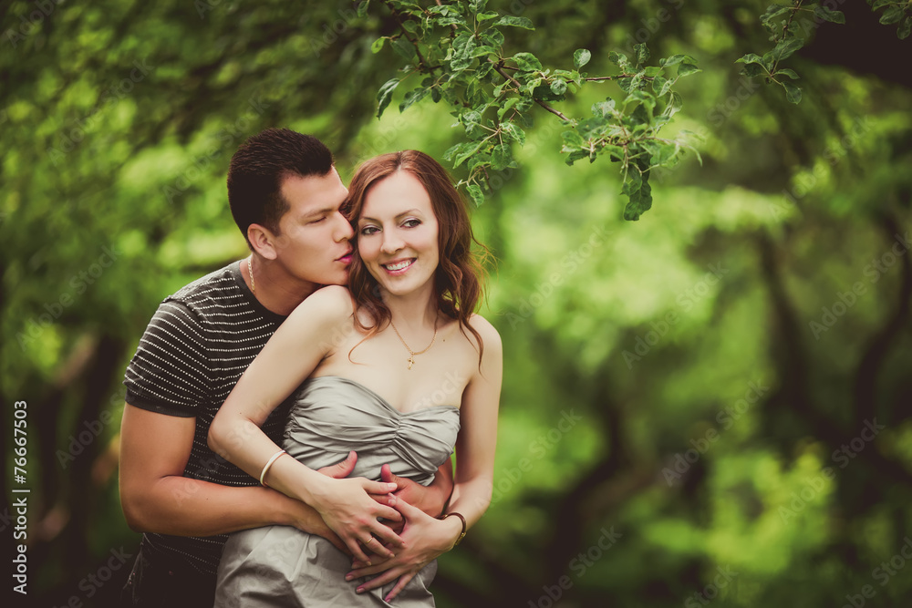 loving couple are hugging in park loving couple are hugging in park