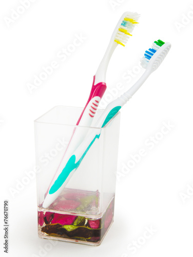 colorful family toothbrushes isolated on white background