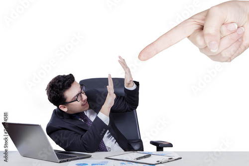 Hand pointing at caucasian businessman