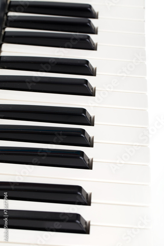 Side view of electronic piano keyboard keys. Macro