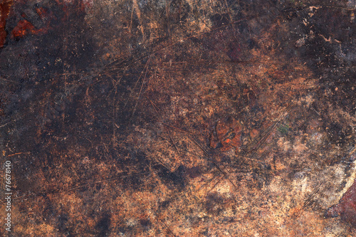 Foto Dark wooden surface with scratches