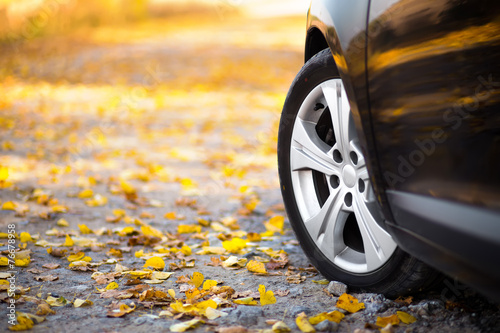 The car on the nature. Wheels and tyres closeup near autumn park © kozirsky