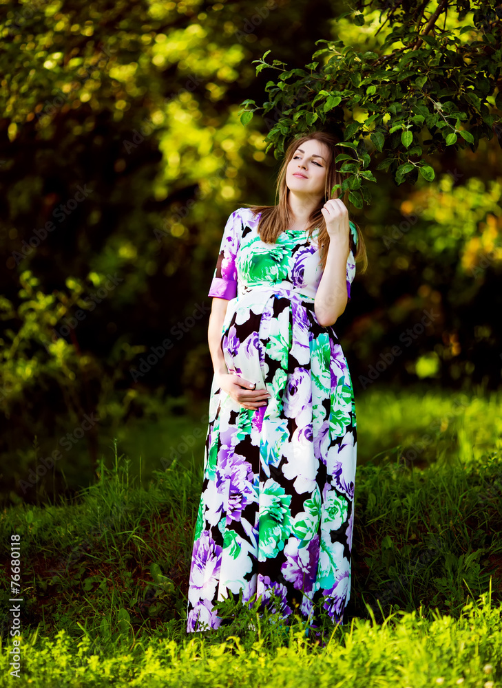 Beautiful pregnant woman in sunny park Beautiful pregnant woman in sunny park