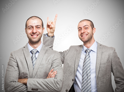 Man making the horns sign to himself