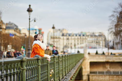 Happy young tourist walking in Paris