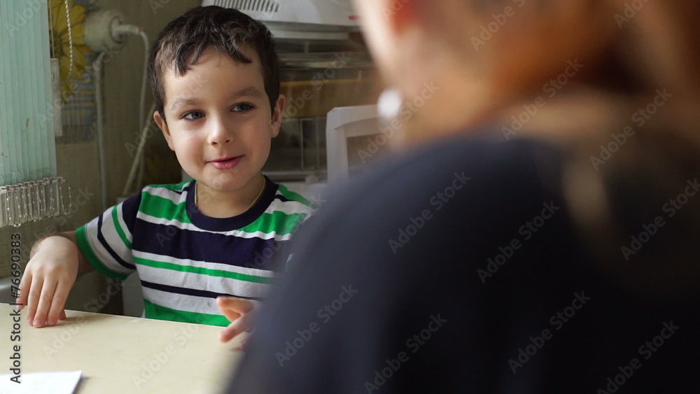 Cute boy repeats the gestures of the grandmother Cute boy repeats the gestures of the grandmother