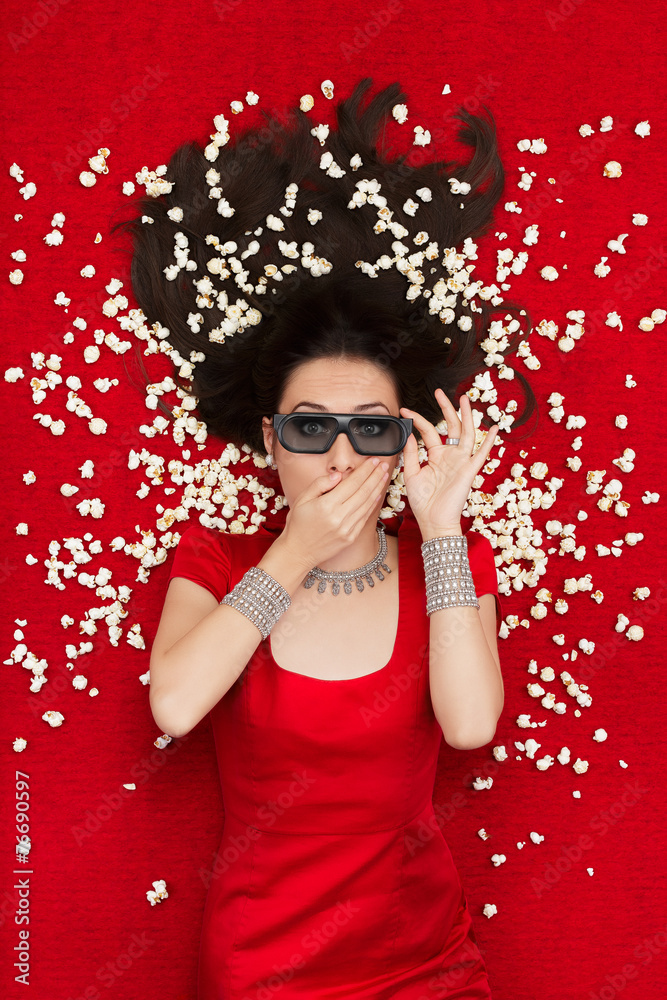 Fototapeta premium Surprised Girl with 3D Cinema Glasses and Popcorn Seeing a Movie