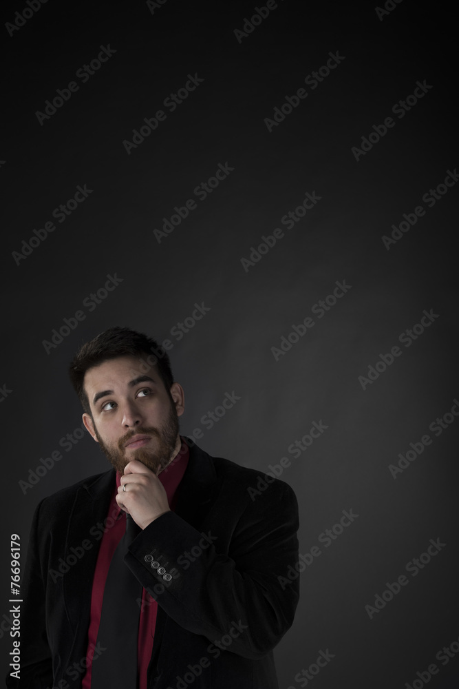 Thoughtful Businessman Looking Up with Copy Space Thoughtful Businessman Looking Up with Copy Space