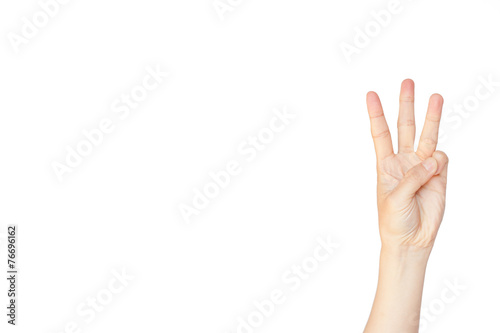 Japanese hand gesture: Number three on isolated white background photo