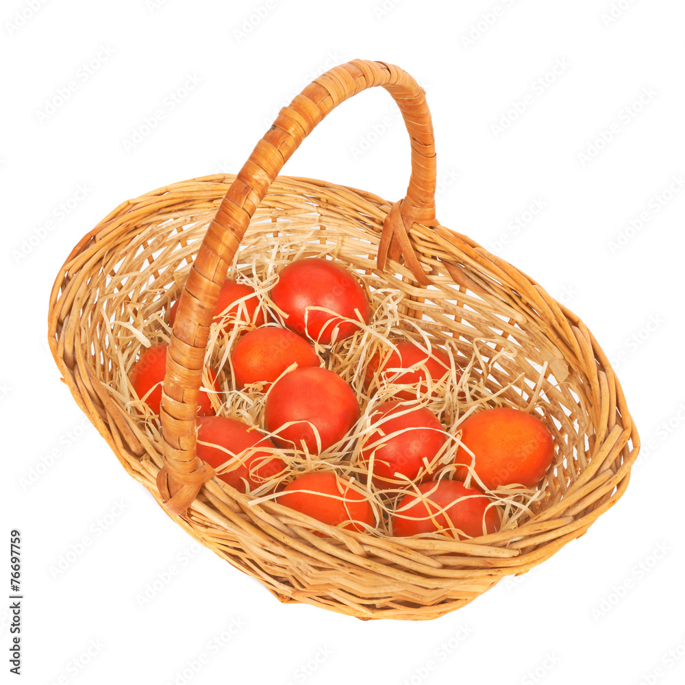 Red Easter eggs in a basket. Isolated on white Red Easter eggs in a basket. Isolated on white