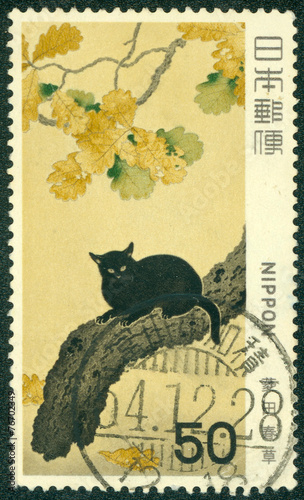 stamp printed in Japan and shows Bonsai tree and black cat