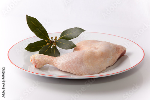 Chicken leg with bay branch photo