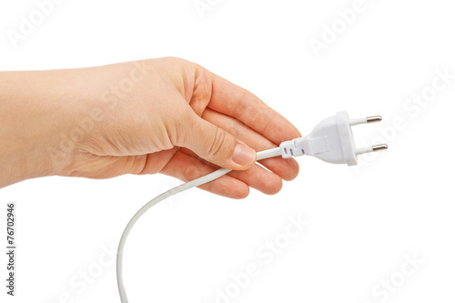 Hand holding electric plug. Isolated on white