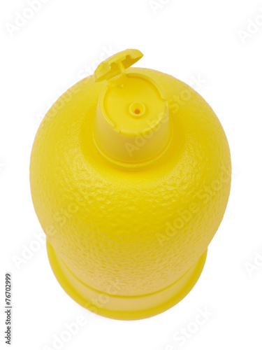 Plastic bottle of lemon juice to the sauce isolated on white bac