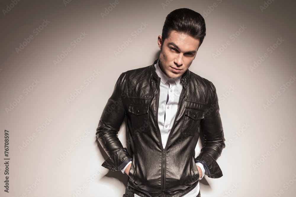 Fototapeta premium young man holding both hands in his pocket