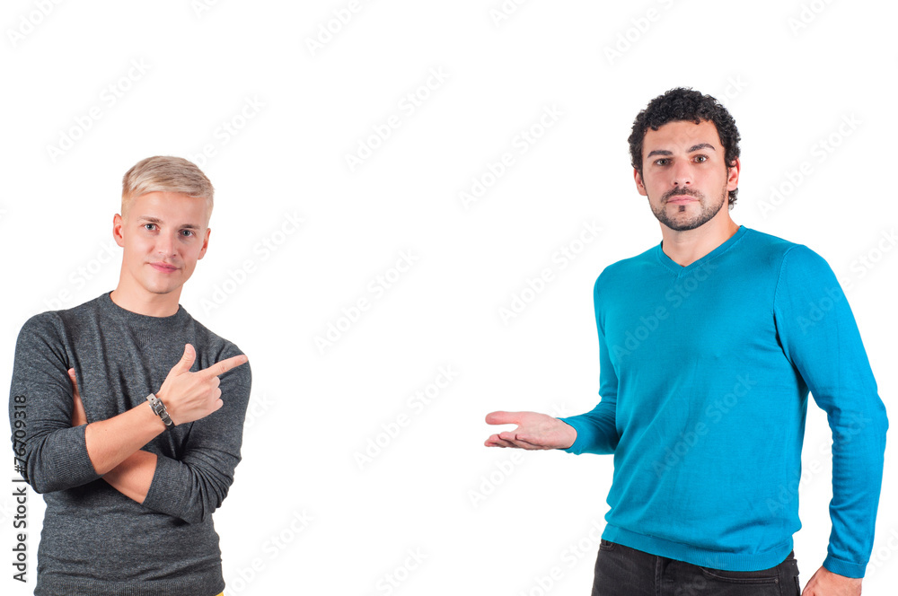 Two handsome male showing somewhere with fingers Two handsome male showing somewhere with fingers