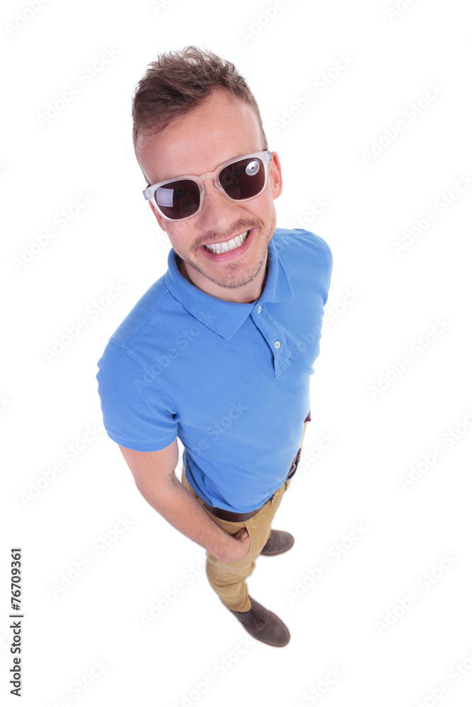 casual young man with hands in pockets casual young man with hands in pockets