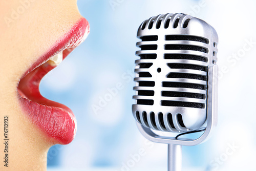 Photography Singing woman and retro microphone, karaoke concept