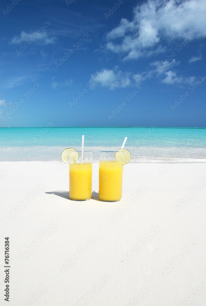 Orange juice on the beach. Great Exuma, Bahamas Orange juice on the beach. Great Exuma, Bahamas