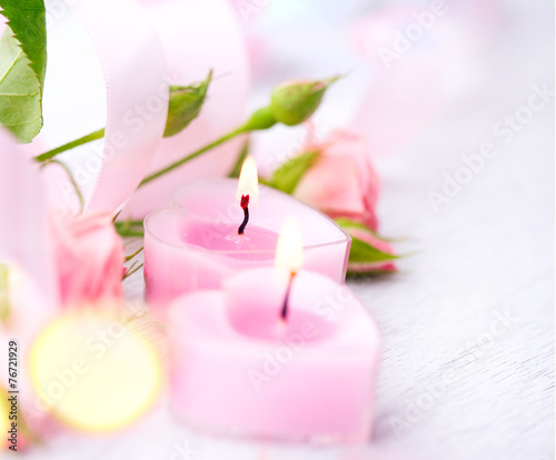 Valentine's Day. Pink heart shaped candles and rose flowers