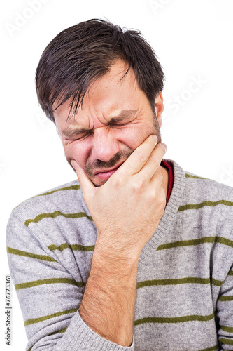 Obraz na płótnie Young man suffering from a terrible tooth ache w salonie