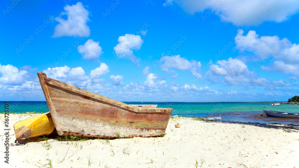 Small wooden boat on the beach
