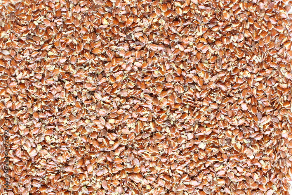 Top view of broken flax seeds . Can be used as background