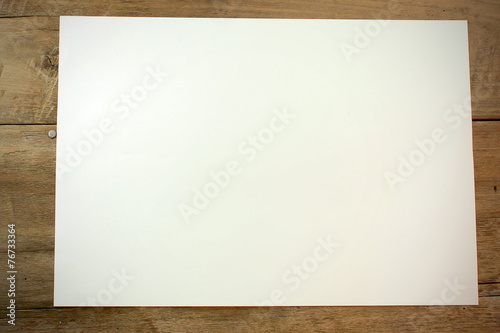 White paper on brown wood