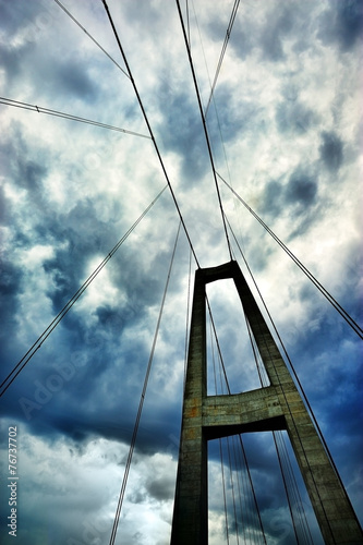 Suspension bridge and dramatic clouds © connel_design