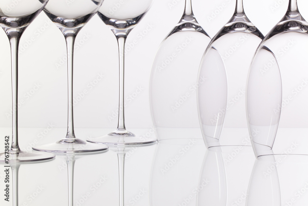 Six wine glasses on a glass desk Six wine glasses on a glass desk