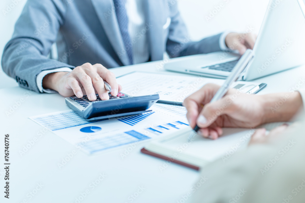 Business people discussing the charts and graphs showing the res Business people discussing the charts and graphs showing the res