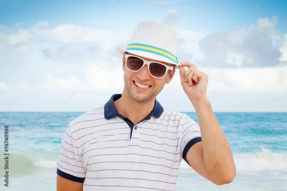 Outdoor portrait of young smiling Caucasian man