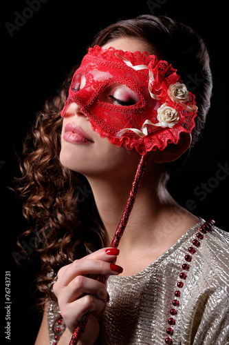 Beautiful girl with masquer...