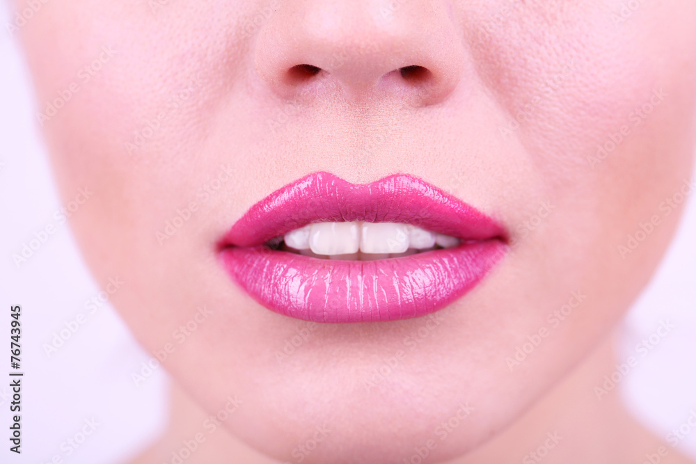 Fototapeta premium Lipstick on lips, white background