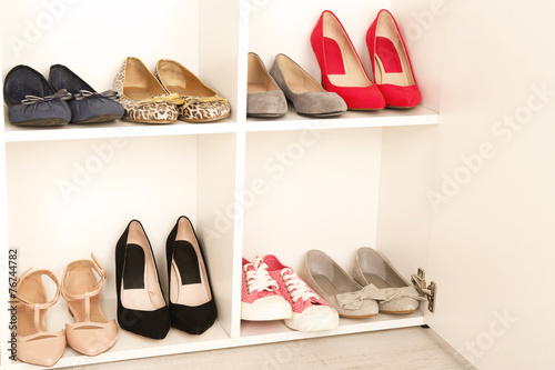 Collection of shoes on shelves