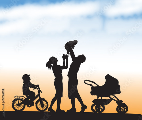 silhouette family with children on the walk